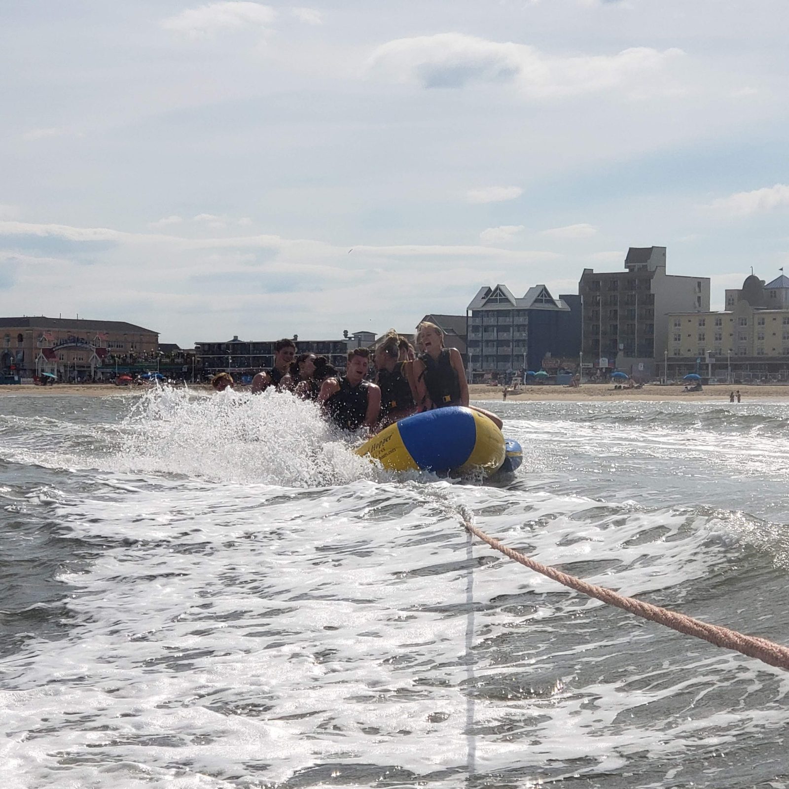 a person flying a kite in a large body of water