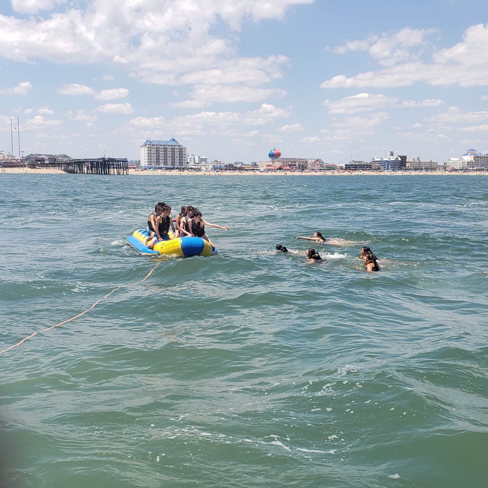 a group of people swimming in a body of water